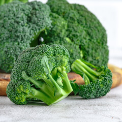 Macro photo green fresh vegetable broccoli.Cauliflower and broccoli. Fresh green broccoli on a stone table.Broccoli vegetable is full of vitamin.Vegetables for diet and healthy eating.