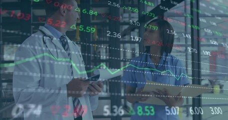 Animation of trading board and graphs over diverse doctors discussing medical reports in hospital - Powered by Adobe
