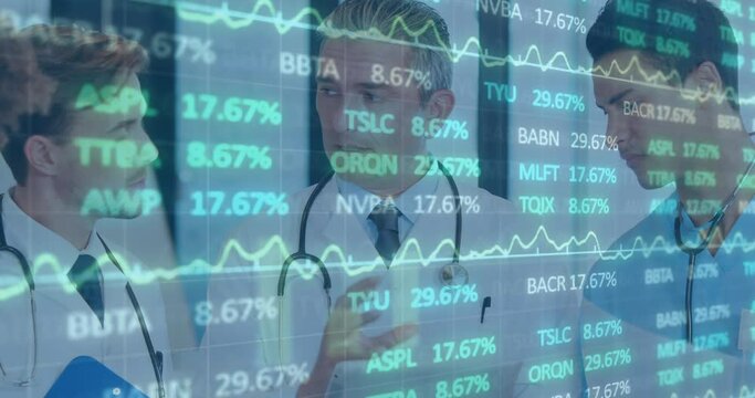Animation of stock market data moving over caucasian doctor explaining to coworkers over tablet