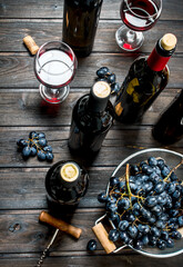 Wine background. Red wine in glasses with grapes.