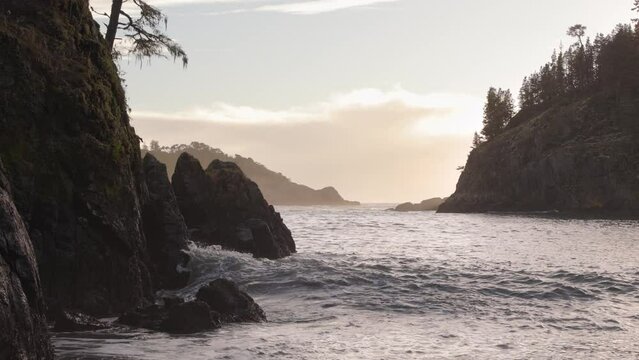 Beautiful coastline West Coast Canada, small ocean cove, waves crashing, seaside forest, Sooke, BC. 4K 24FPS