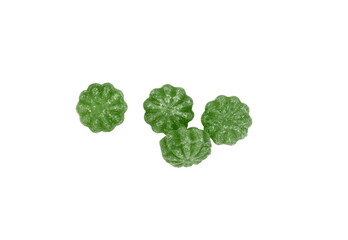 Green mint candies isolated on white background