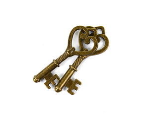 two vintage keys isolated on white. Two heart-shaped keys.