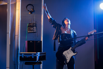 Punk rocker doing live performance in studio, creating funky cool vibe with heavy metal alternative...