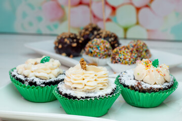 cupcakes with cream and sprinkles