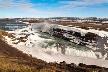 Scenic view of the mighty Gullfoss waterfall in winter, one of the most popular landmarks at the Golden Circle Route, Iceland