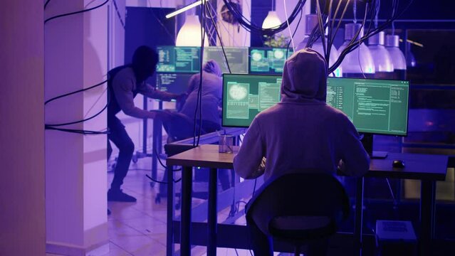 Diverse team of people running from police lights in office, law enforcement agencies stopping criminals late at night. Police operation stopping illegal activities based on cyberbullying.