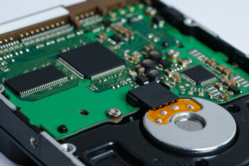 View of the printed circuit board of a computer hard drive. Close up.