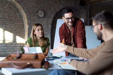 Business people discussing over new business project in office