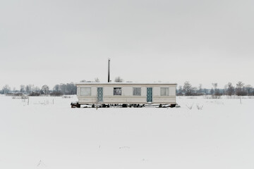 Fototapeta na wymiar a trailer park house in winter
