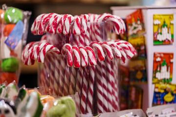 New Year's lollipops on the counter, white-red lollipops close-up.