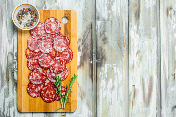 Sliced smoked salami with garlic and herbs.