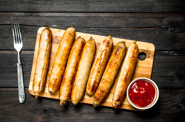 Grill sausages with tomato sauce.