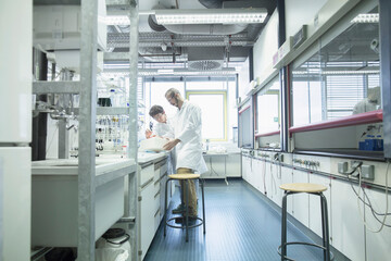 Two scientist working in a pharmacy laboratory, Freiburg im Breisgau, Baden-Württemberg, Germany