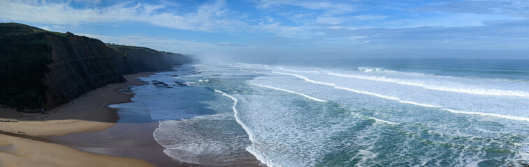 Magoito Beach during storm and high waves, beautiful sandy beach on Sintra coast, Lisbon district,...