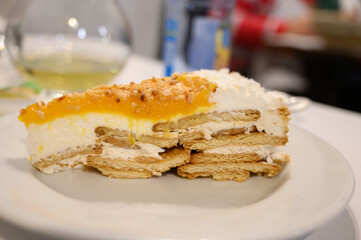 Traditional Portuguese cake with cream, fruits and cookies