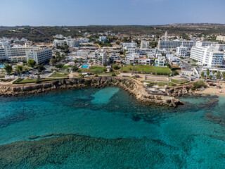 Aerial panoramic view on holidays resorts and blue crystal clear water on Mediterranean sea near Fig Tree beach, Protaras, Cyprus
