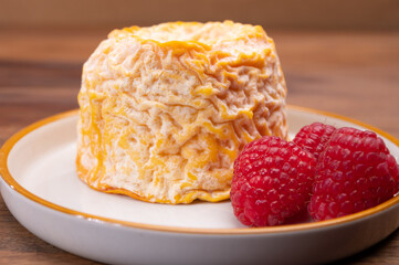 French Langres soft cows crumbly cheese with washed rind structure made in Champagne - Ardenne region