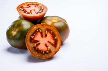Fresh ripe sweet reddish brown and green kumato tomatoes