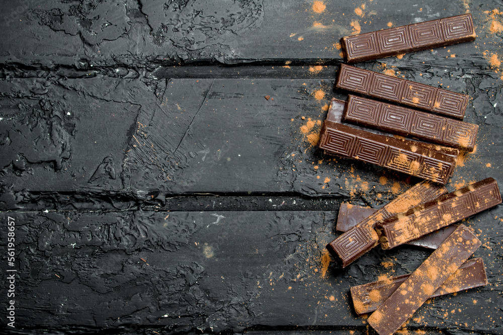 Wall mural Dark chocolate with cocoa powder.