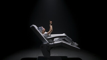 Future reality headset woman touching metaverse. Gamer playing in haptic gloves