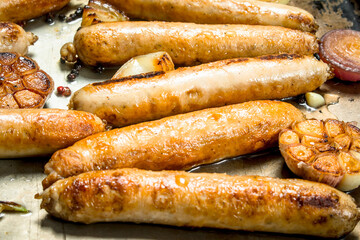 Fried sausages with garlic and onions.