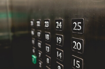 Close up of elevator board with floor buttons with 25 floors