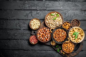 Assortment of different nuts in bowls.