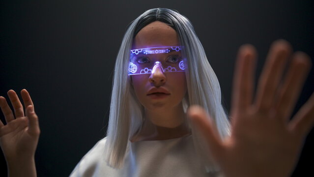 Girl hands using invisible touchscreen closeup. Hightech work process metaverse