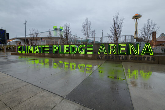 Seattle, WA, USA - January 12, 2023; Illuminated Climate Pledge Arena Sign At The Seattle Venue In The Soaking Rain