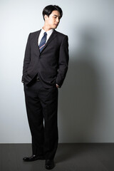 Image of an Asian businessman in a cool suit Vertical	