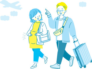 里帰り出産する妊婦さんと荷物を持つ夫