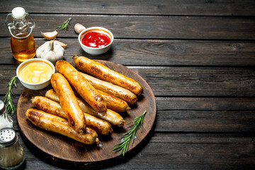 Fragrant grilled sausages with sauces and herbs.