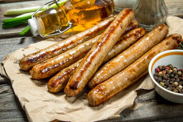 Grill sausages with herbs and spices.