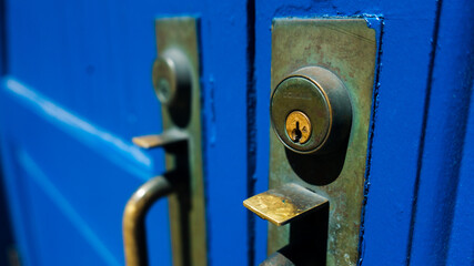 blue door with rustic old locks