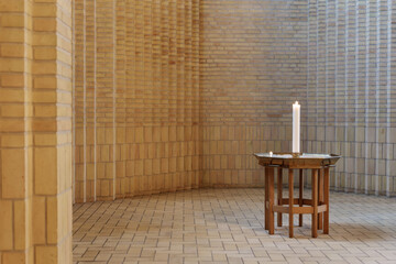 Selective focus view at wooden table and candle at the aisle vault corridor beside aisle seat at...