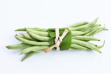 Green beans on white background.