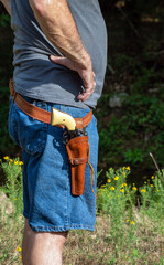 Obraz premium Pistol and holster modeled on man's hip
