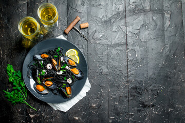 Mediterranean food. Spaghetti with cuttlefish ink, clams and white wine.