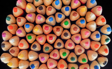 Colored pencils on a black chalkboard