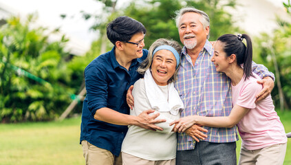 Portrait enjoy happy smiling love multi-generation asian big hug family.Senior mature father and...