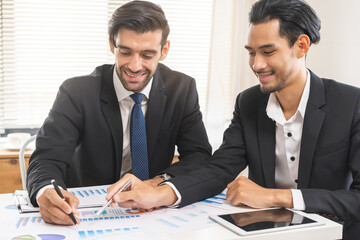 Business people meeting. Businessman, partnership planning strategy of project, brainstorming with colleague, using device on touchpad, tablet analyzing data, discussing document, paperwork at office.