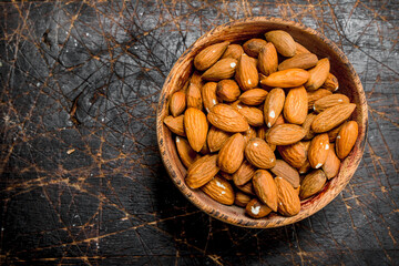 Almonds in bowl .