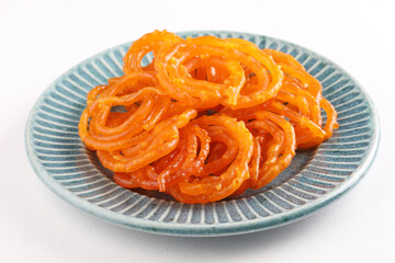 jalebi is a delicious Indian sweet made from flour, food and sugar syrup