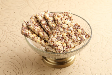peanut chikki or peanut bar with seeds, a healthy snack