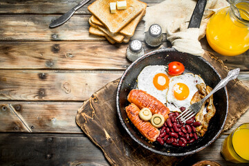 traditional English breakfast. Appetizers with fried bread and orange juice.
