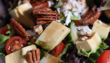 Fresh Salad with Avocado, Tomatoes, Feta and Pecan. Macro Close up.