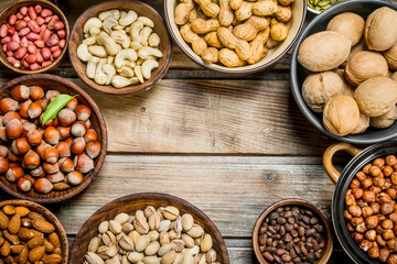 Assortment of different nuts in bowls.