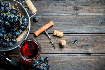 Wine background. Red wine in glasses with grapes.