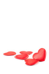 Pile of red hearts shapes on a white background with copy space above, Valentines day concept.